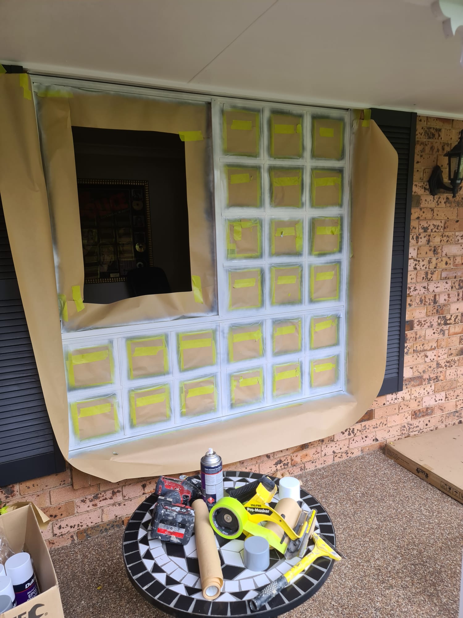 Windows and trim masked and prepped before painting on a Sydney job