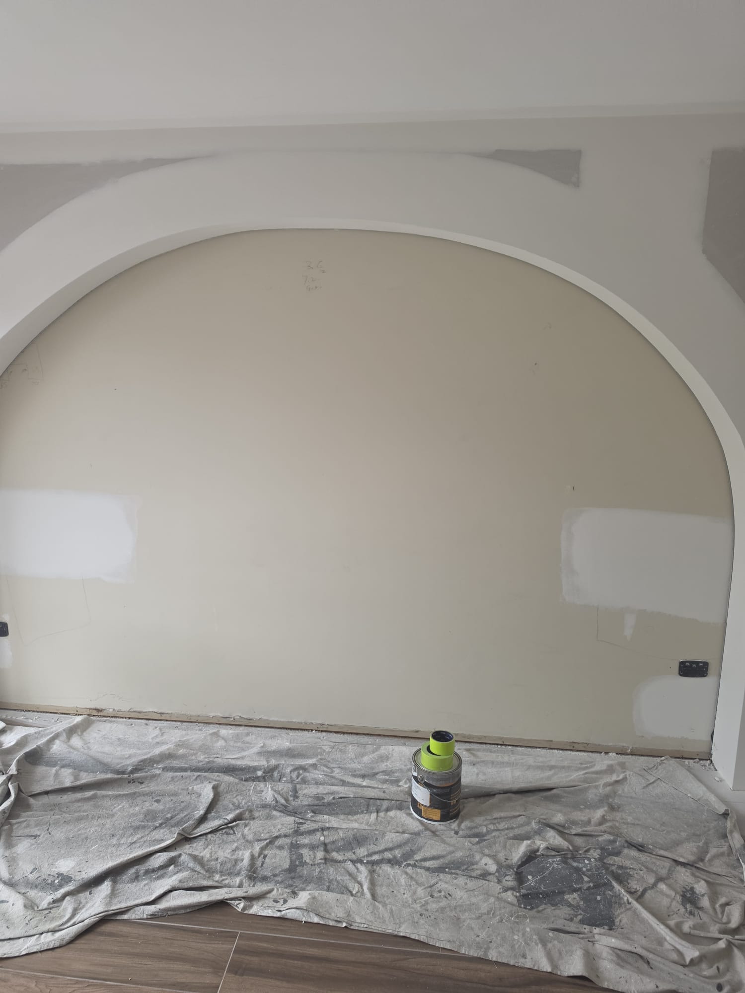 Maestro Painting interior painter applying a smooth roller coat to a wall in a bright Sydney living room